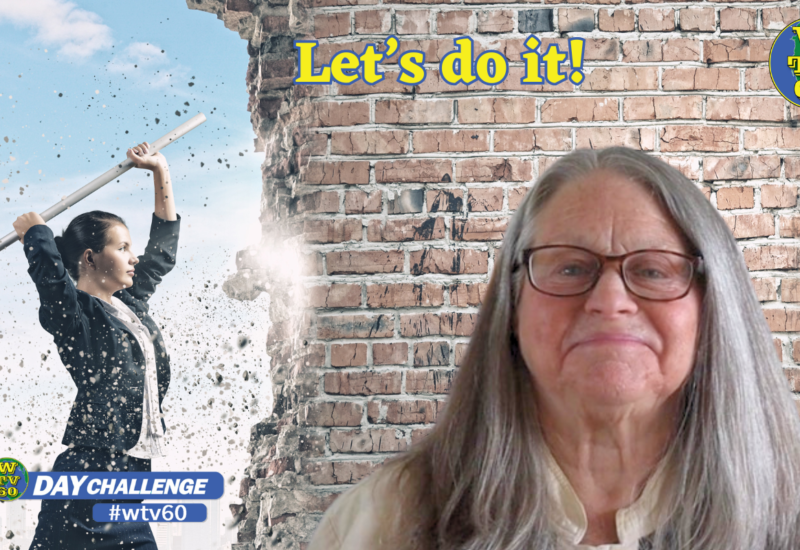 WTV60 founder Dorothy Kelly against a background of a women breaking a brick wall with a sledge hammer, the words, "Let's do it!" captioned.
